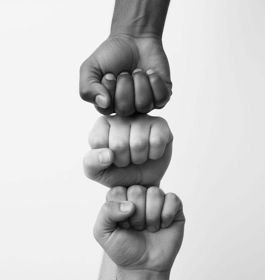 Three fists stacked together